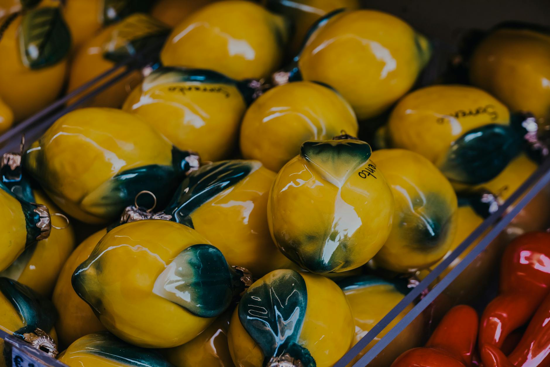 Vibrant yellow lemons arranged on a market display, symbolizing the playful, approachable nature of lemon vibrators